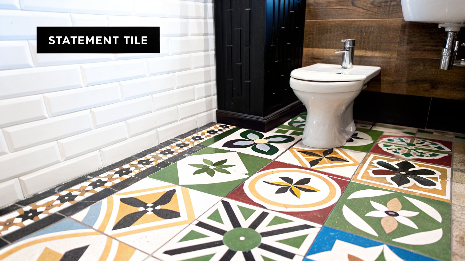A vibrant bathroom featuring colorful patterned floor tiles, white subway wall tiles, and a white toilet.