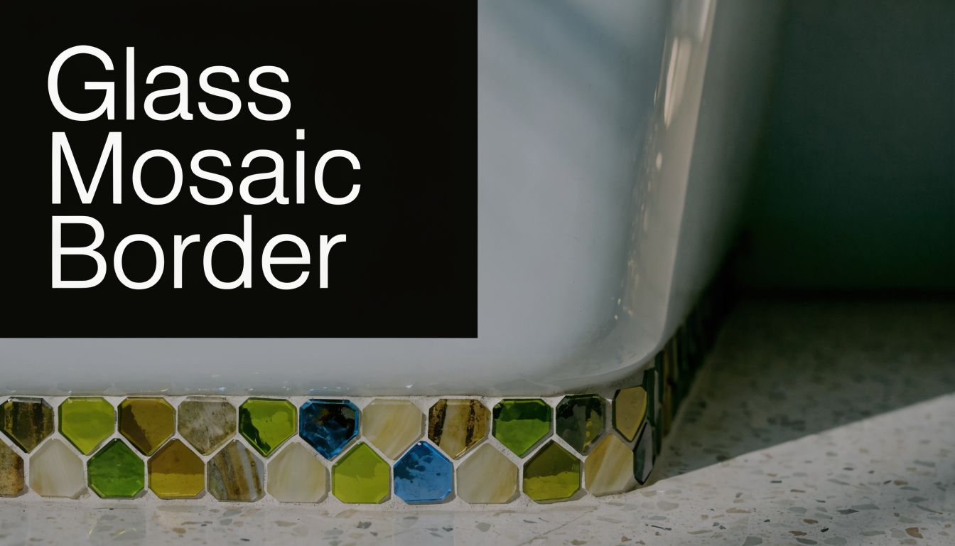 A close-up view of colorful glass hexagon mosaic tiles bordering the base of a white bathtub.