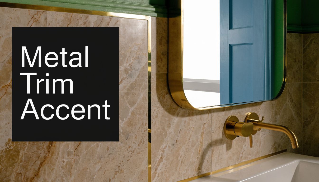 A close-up view of a bathroom vanity featuring elegant brass metal trim accents on marble wall tiles.