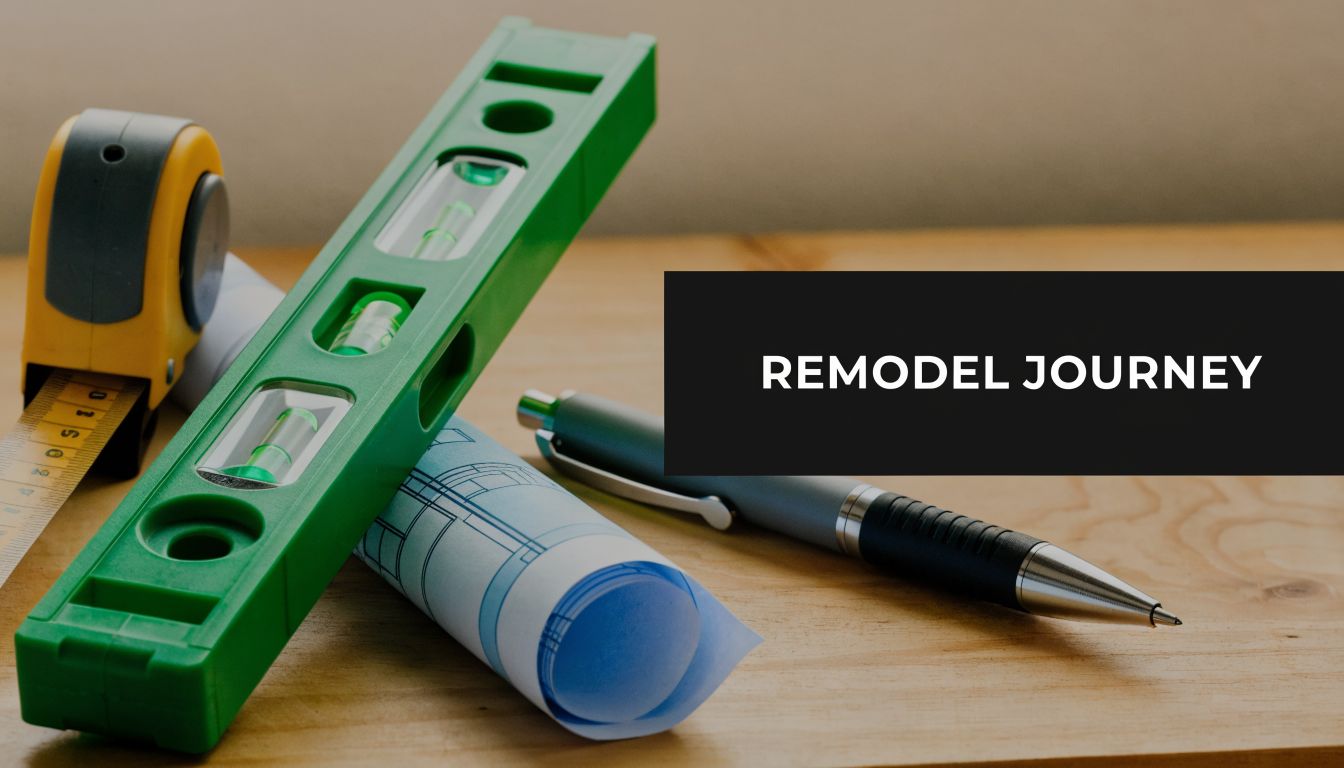 A green level, measuring tape, and blueprints with a pen on a wooden table, representing remodeling.